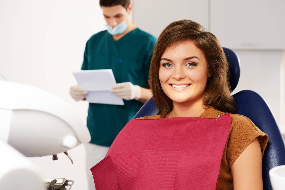 woman smiling in a dental chair