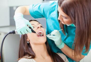 woman getting teeth cleaned
