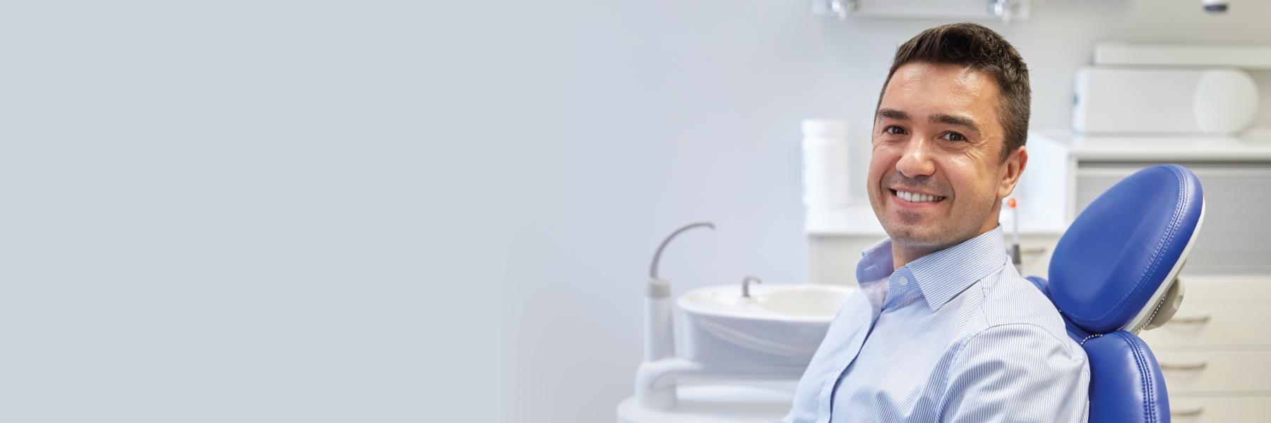 man smiling in dental chair 