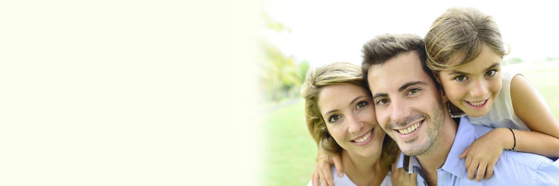family of three smiling