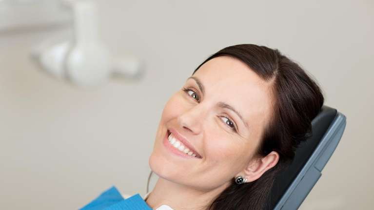 A lady undergoing teeth whitening in Milwaukee, WI.