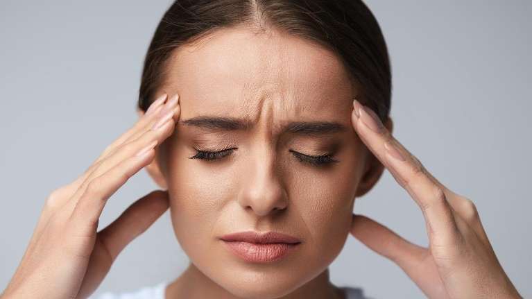 A woman having persistent jaw pain in need of a TMJ specialist in Milwaukee, WI