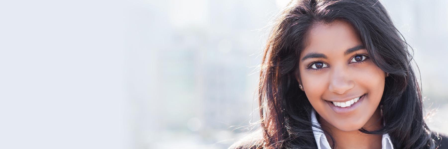 woman smiling after treatment for halitosis