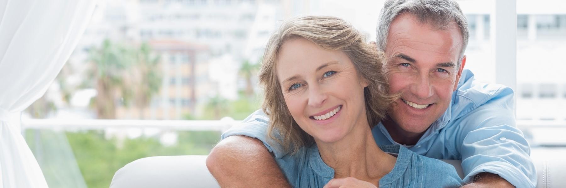 man and woman smiling after oral cancer screening