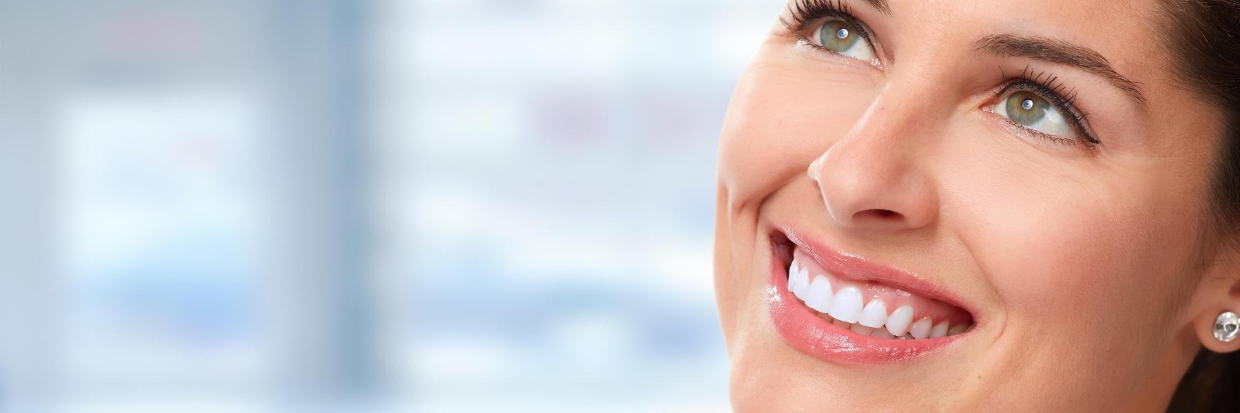 woman smiling after getting cerec crowns in West Allis