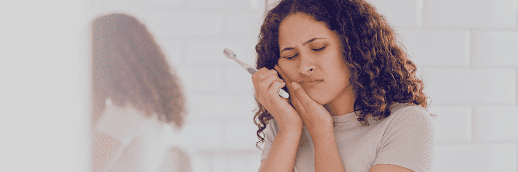 man smiling in chair after emergency dental care