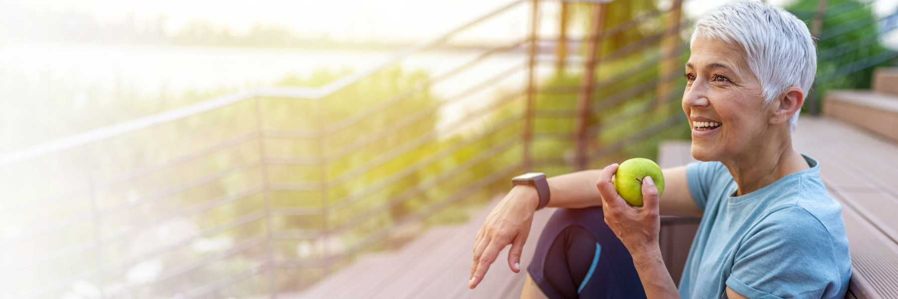 man smiling in chair after TMJ treatment