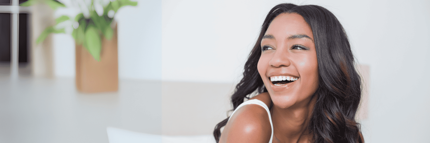woman smiling after getting veneers